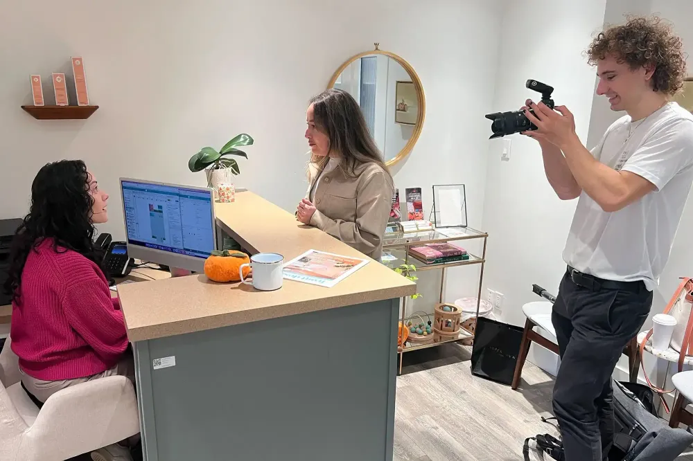 Ian capturing clinic photos at a photoshoot