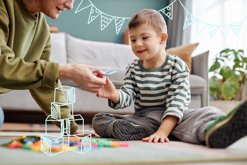 A young child plays with puzzle pieces on the floor of a waiting room and an adult hands them a piece